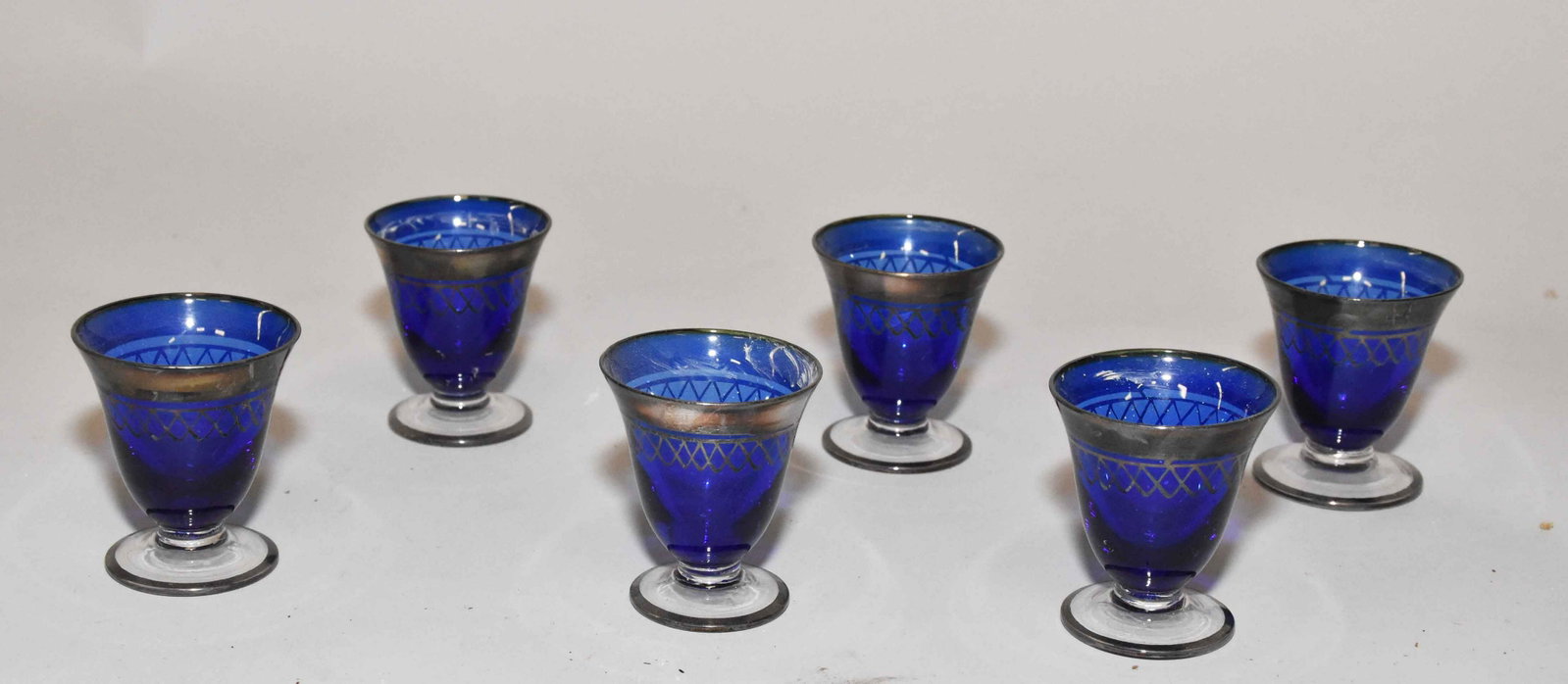(6) COBALT TO CLEAR CORDIAL SHOT GLASSES, with silver: (6) COBALT TO CLEAR CORDIAL SHOT GLASSES, with silver overlay.