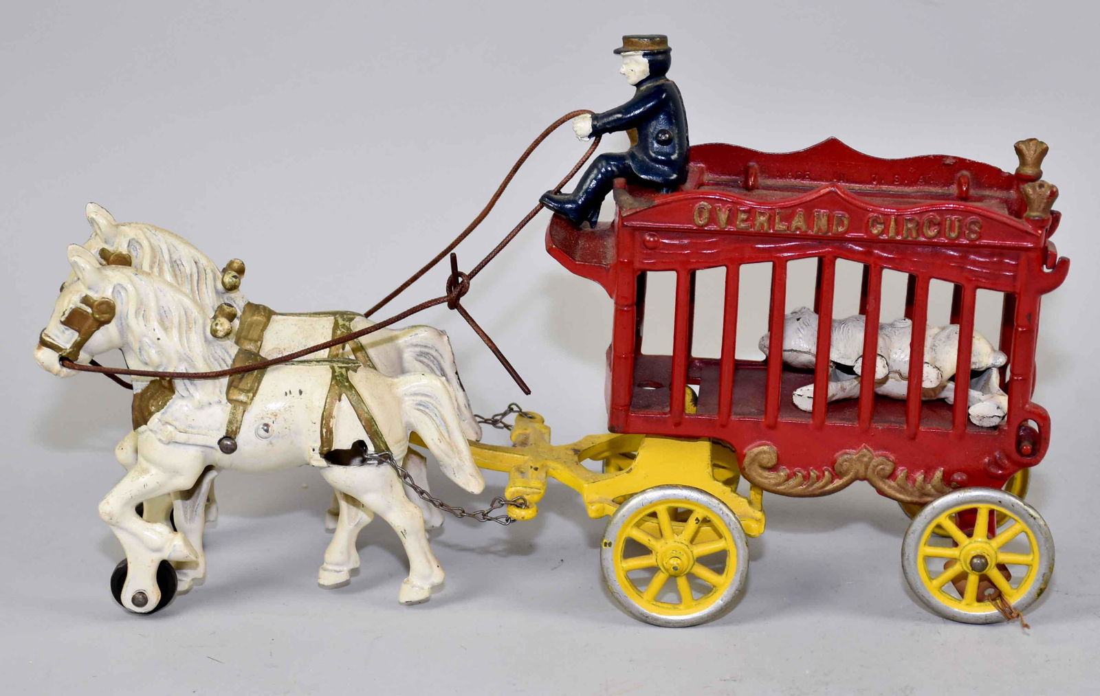 ANTIQUE OVERLAND CIRCUS CAST IRON TOY. 8''H x 3.5''W x: ANTIQUE OVERLAND CIRCUS CAST IRON TOY. 8''H x 3.5''W x 14''L.