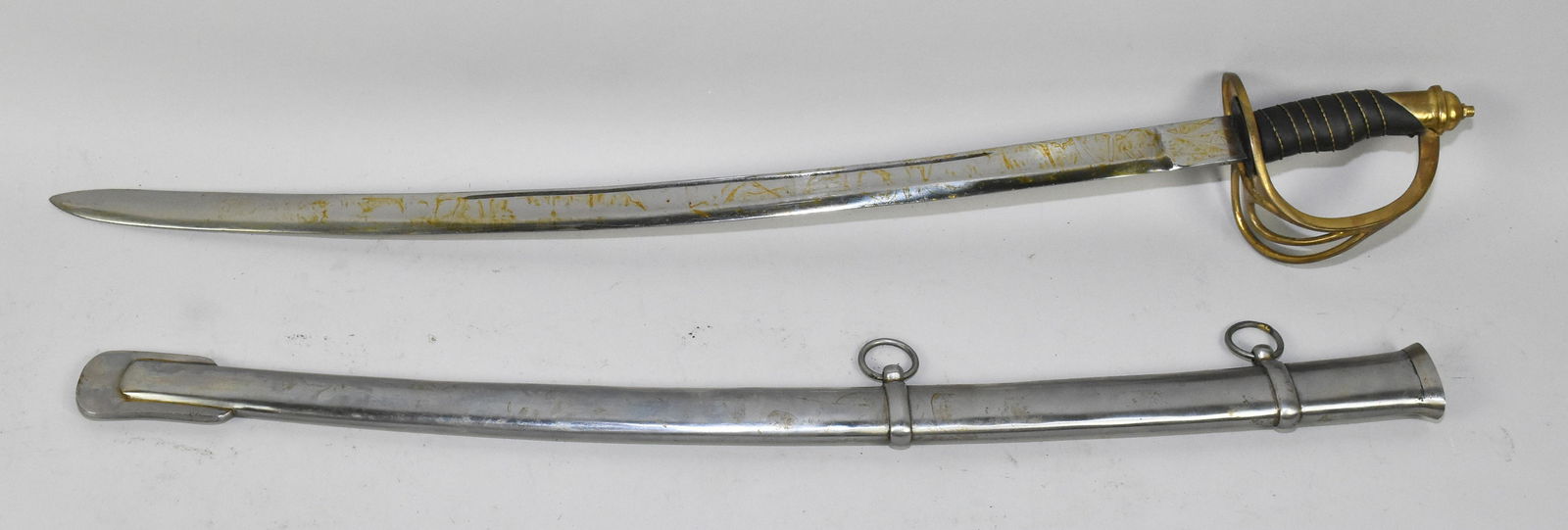 REPLICA CHILD'S/CADET CIVIL WAR ERA SABER - 23'': REPLICA CHILD'S/CADET CIVIL WAR ERA SABER - 23'' slightly curved blade with wire-wrapped leather grip with three branch guard and pommel. Steel scabbard with brass mounts.