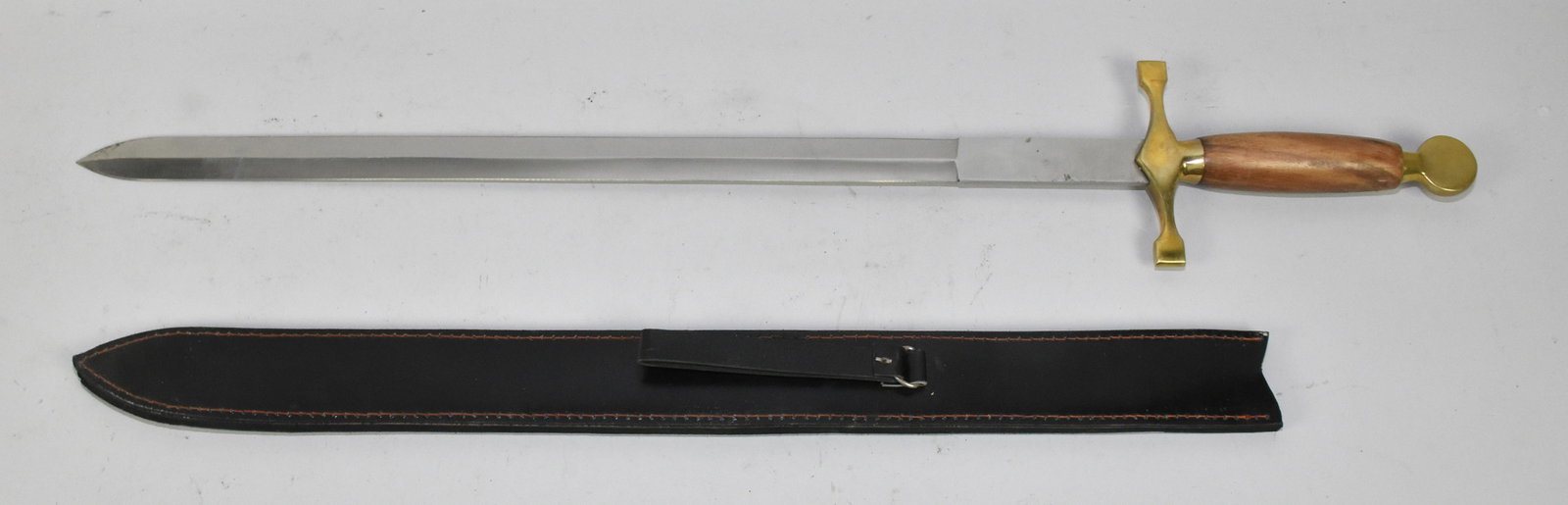 REPLICA MEDIEVAL DOUBLE-EDGE SWORD - 24'' double edge: REPLICA MEDIEVAL DOUBLE-EDGE SWORD - 24'' double edge blade. Unmarked: wood grip; brass guard and pommel. Leather scabbard