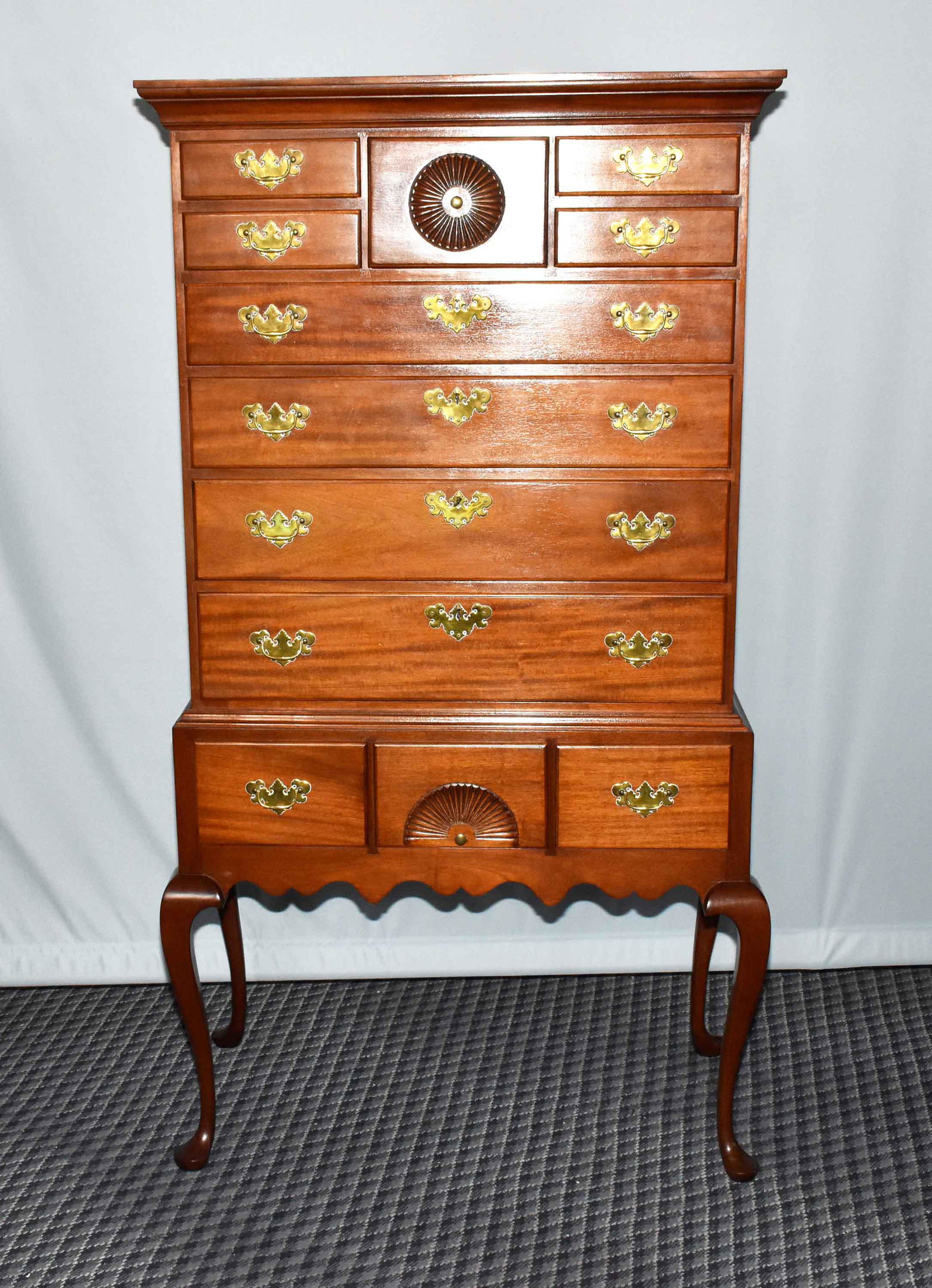 COPENHAVER'S WINCHESTER. VA. MAHOGANY FLAT TOP HIGHBOY: COPENHAVER'S WINCHESTER. VA. MAHOGANY FLAT TOP HIGHBOY - circa 1950. Nine drawers over three; fine cabriole leg base. Batwing pulls and lock escutcheons. 5'11''H x 39''W x 20'' deep.