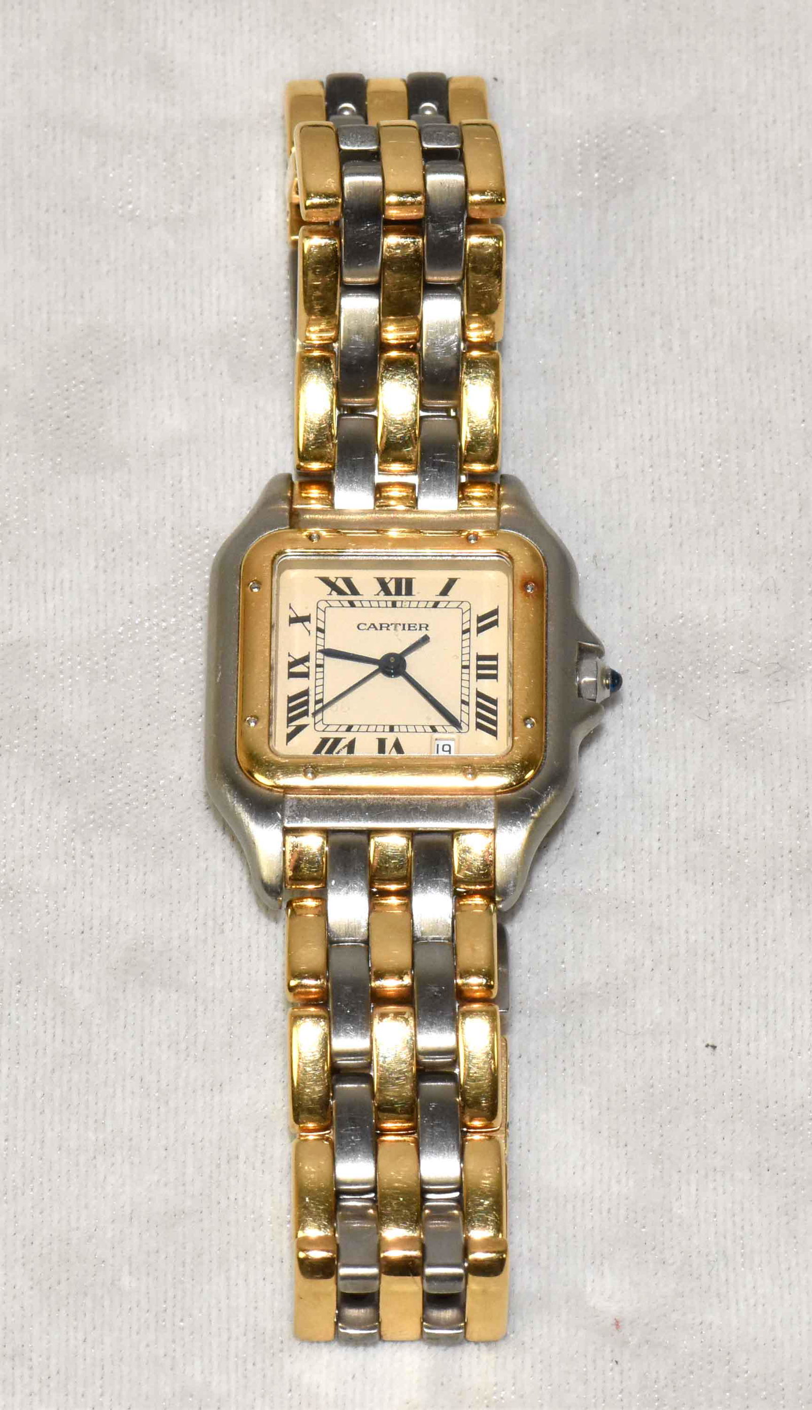 CARTIER PANTHERE TWO-TONE WATCH. Stainless steel case: CARTIER PANTHERE TWO-TONE WATCH. Stainless steel case with 18K gold bezel. 18K yellow gold and stainless steel band with stainless steel hidden butterfly clasp. Quartz battery movement. Sapphire cryst