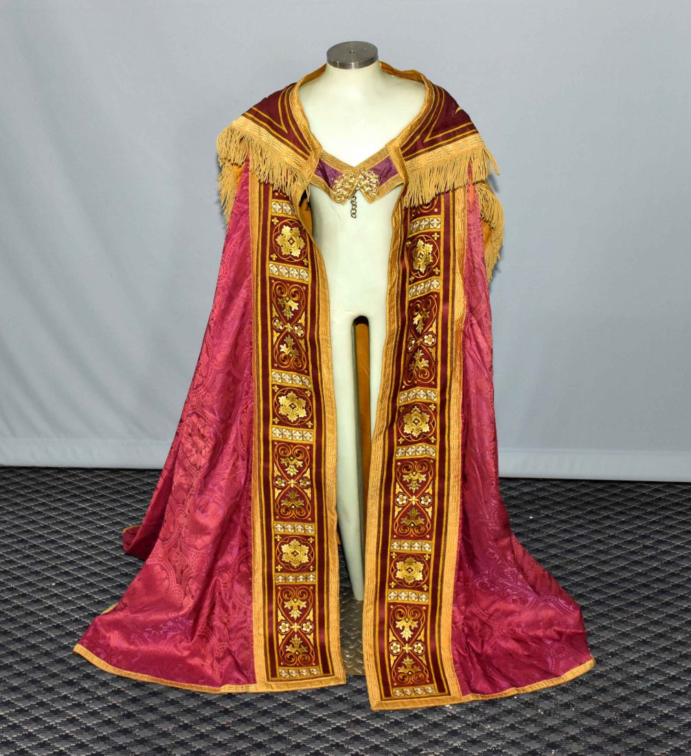 ANTIQUE BYZANTINE PRIEST: ANTIQUE BYZANTINE PRIEST'S CAPE. Made in Germany ''Max E. Brodbeck Company'', Brooklyn, NY. Turn of the century with brass cups heavily brocaded and metal stitching 'IHS' metal stitching on cape. Age 