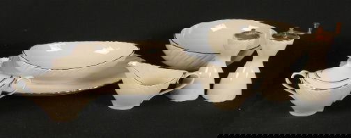 LENOX LAURENT SERVEWARE.: LENOX LAURENT SERVEWARE. The dishes are cream colored with a gilt trim. Marked: (Lenox symbol); Lenox Laurent; Lenox, Inc.; Made In U.S.A. Lot includes the following pieces: oval serving bowl, round s