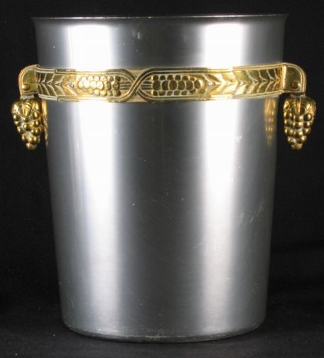 KENSINGTON WARE WINE COOLER: KENSINGTON WARE WINE COOLER. C.1935. Art Deco aluminum and brass Kensington Ware ''Coldchester Wine coller'' cat. no. 7250. Designed by Lurelle Guild. Aluminum body with brass frieze and brass grape p