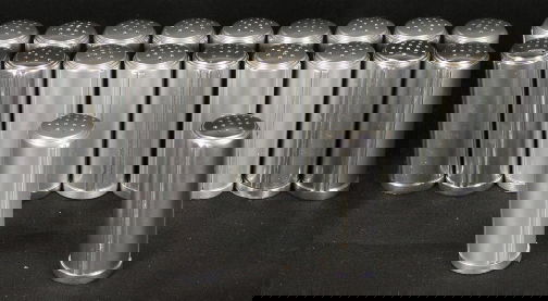 RALEIGH SALT AND PEPPER SHAKERS: 20 RALEIGH SALT & PEPPER SHAKERS. Twenty Kensington Ware Raleigh salt and pepper shakers cat. no. 7697, with vertical ribbing. designed by Lurelle Guild 1939-1940. 3''H. Condition: good.
