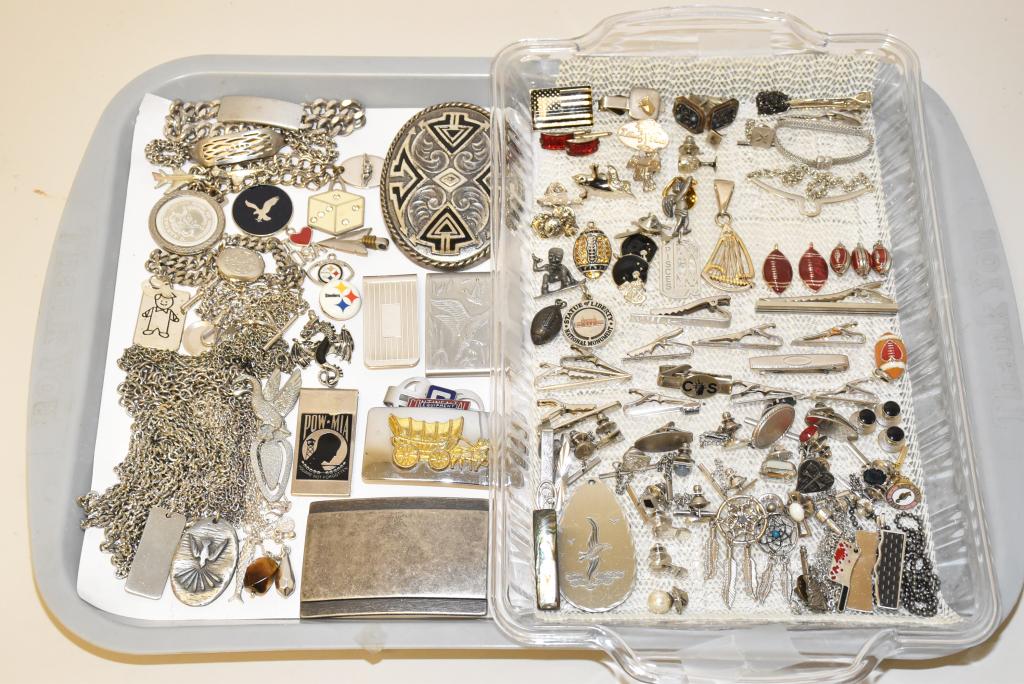 60+ PIECE LOT OF ASSORTED GENTLEMEN'S COSTUME: 60+ PIECE LOT OF ASSORTED GENTLEMEN'S COSTUME JEWELRY IN SILVER TONES. With tie accessories, necklaces, pendants, medical and charm bracelets, pins, belt buckles, money clips and other pieces.