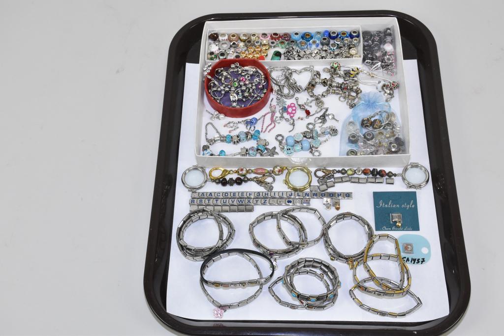 75+ PIECE VARIETY LOT OF BRACELETS, CHARMS: 75+ PIECE VARIETY LOT OF BRACELETS, CHARMS AND PIERCED COSTUME JEWELRY. (15) bracelets, (2) slide and shake chain, all with assorted charms. Variety of rhinestone pierced jewelry.