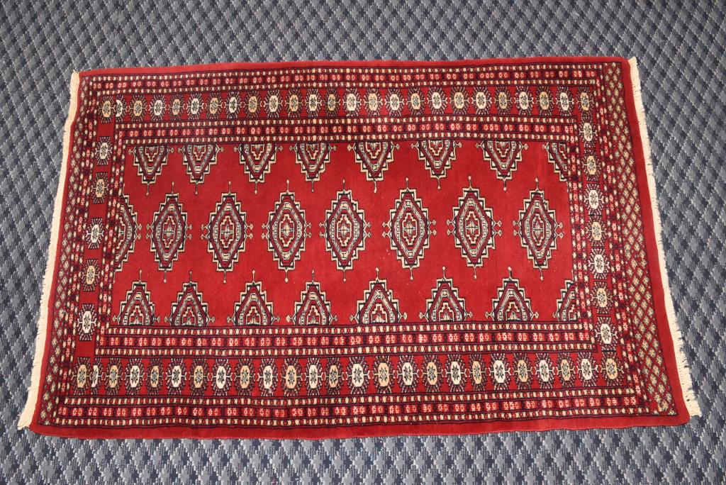 PAKISTAN BOKHARA RUG. Circa 2000. 5' x 3' 3".: PAKISTAN BOKHARA RUG. Circa 2000. 5' x 3' 3".