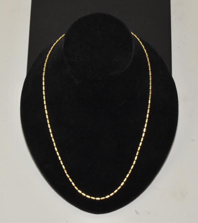 VINTAGE CARTIER 18K YELLOW GOLD BEADED NECKLACE: VINTAGE CARTIER 18K YELLOW GOLD BEADED NECKLACE. With lobster clasp – 20" length. With (100) 18K tubular shaped beads on an 18K chain. Weight:19.31g. Mark –01022 750 402 K.