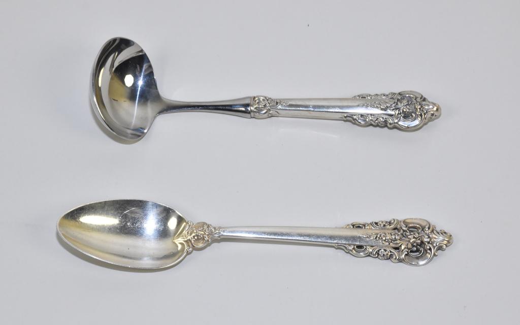 (2) VINTAGE WALLACE GRAND BAROQUE STERLING SIDE PS: (2) VINTAGE WALLACE GRAND BAROQUE STERLING SIDE PIECES. Both marked. To include: Solid Sterling serving spoon 8.75 "long. Sterling handle gravy ladle 8 "long.