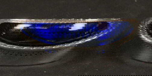 SILVER & COBALT DISH: SILVER & COBALT DISH. Recticulated oval form silver dish with fitted cobalt insert, pierced and incised deocration around body of dish, banded and wrapped rim. Marked: (hallmark 7 branch candelabra in