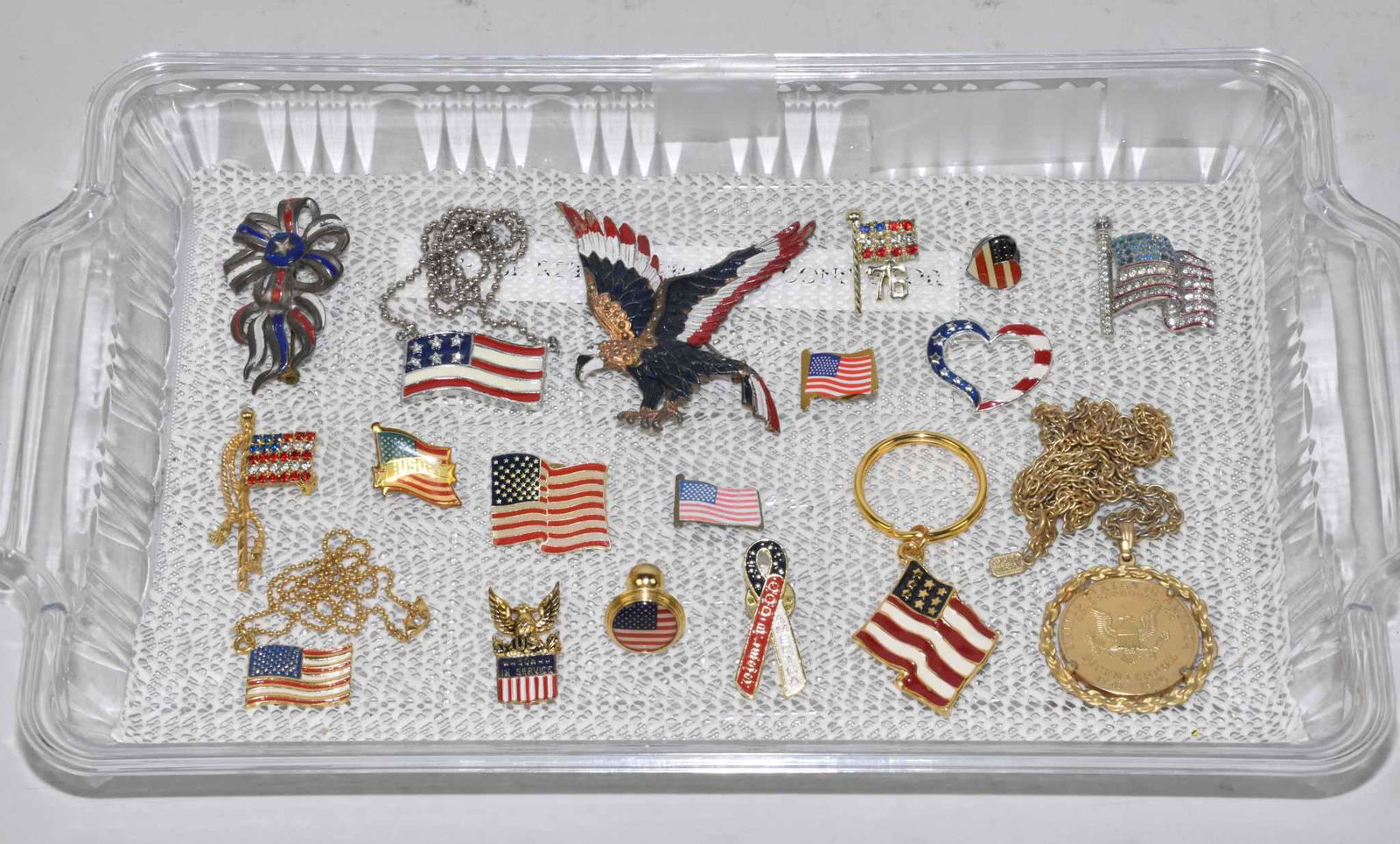 15 ASSORTED PATRIOTIC ENAMELED OR RHINESTONE: 15 ASSORTED PATRIOTIC ENAMELED OR RHINESTONE BROOCHES AND NECKLACES. To include a Sterling Coro US Son in Service pin, 0.1 ozt.
