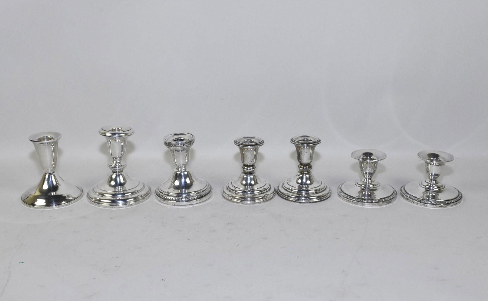 WEIGHTED STERLING SILVER CANDLESTICKS - Seven. (1 of 11)