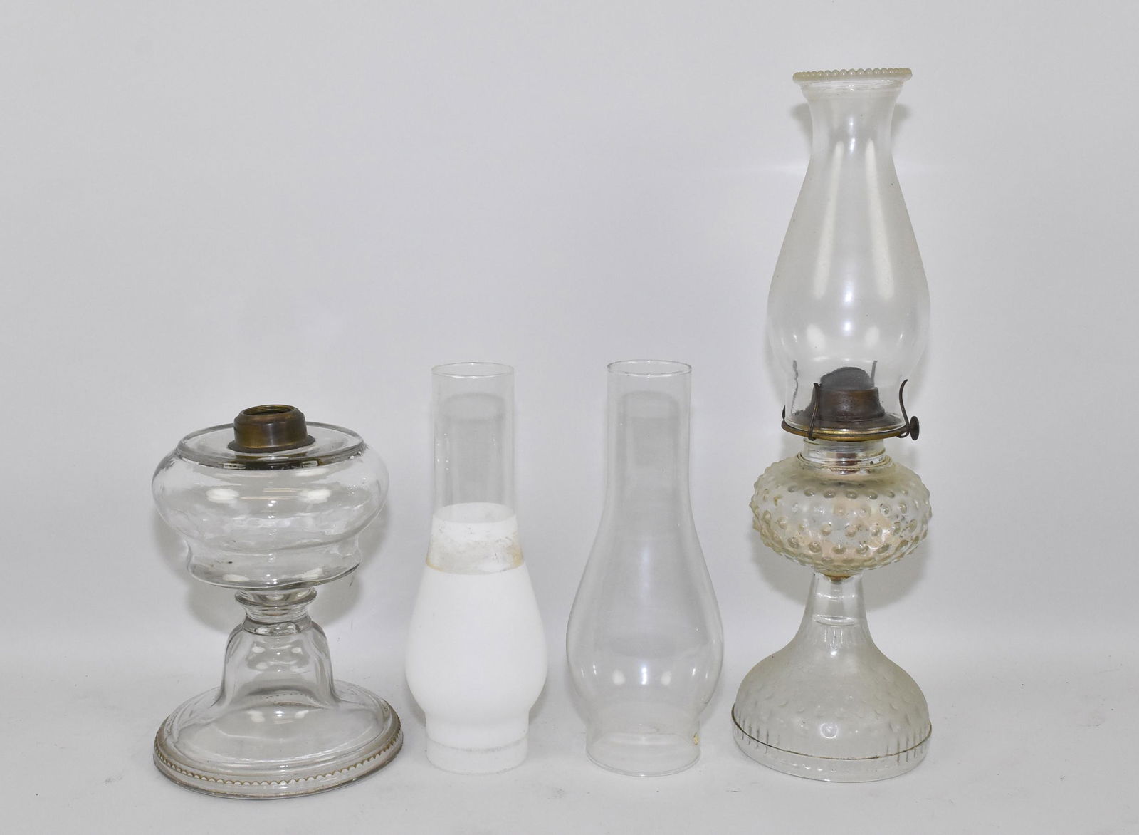 PEDESTAL OIL LAMPS- Two. Clear glass, one with (1 of 5)