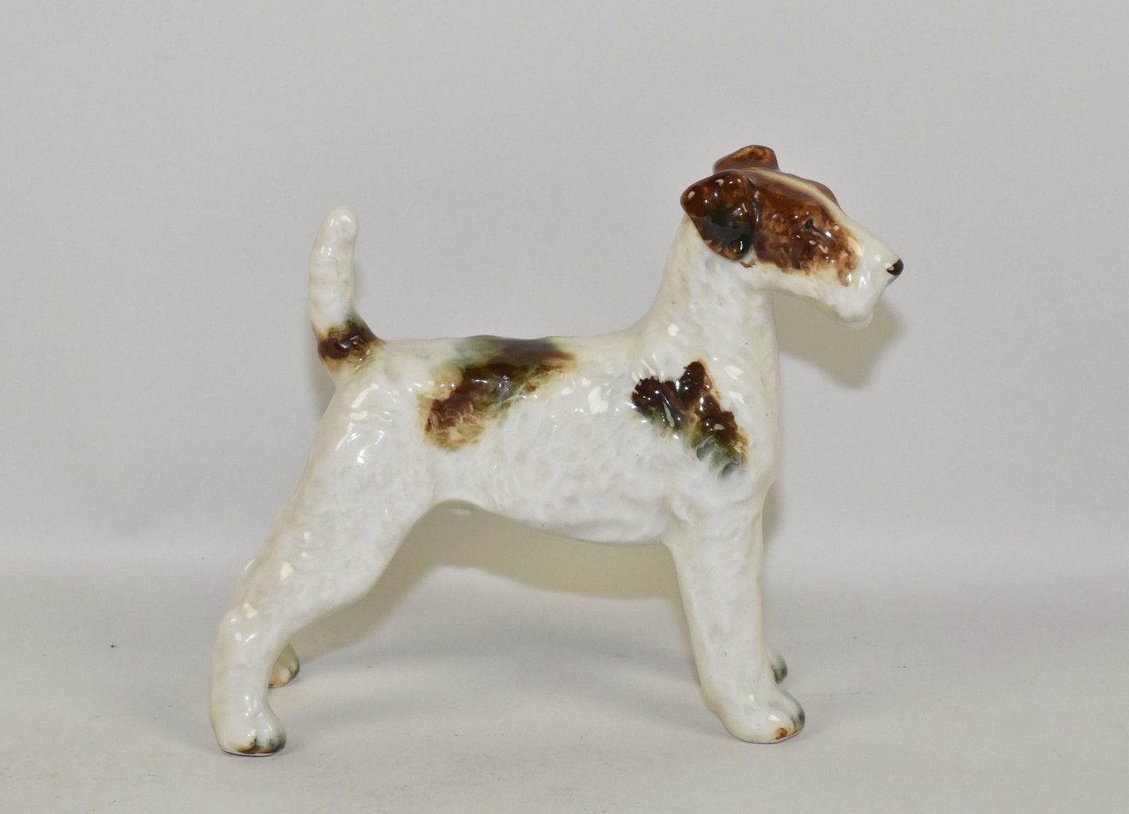 CERAMIC SCOTTISH TERRIER FIGURINE. Made in: CERAMIC SCOTTISH TERRIER FIGURINE. Made in Occupied Japan. 6.5" h x 7.5" w.