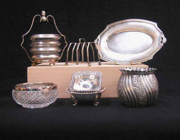 SILVER SERVEWARE N/R.: SILVER SERVEWARE N/R. Lot consists of four silver and glass coasters in a holder; a Rogers Bros. tray; a silver rimmed glass bowl; a toast holder; an embossed bowl with a fluted edge and a pair of mat