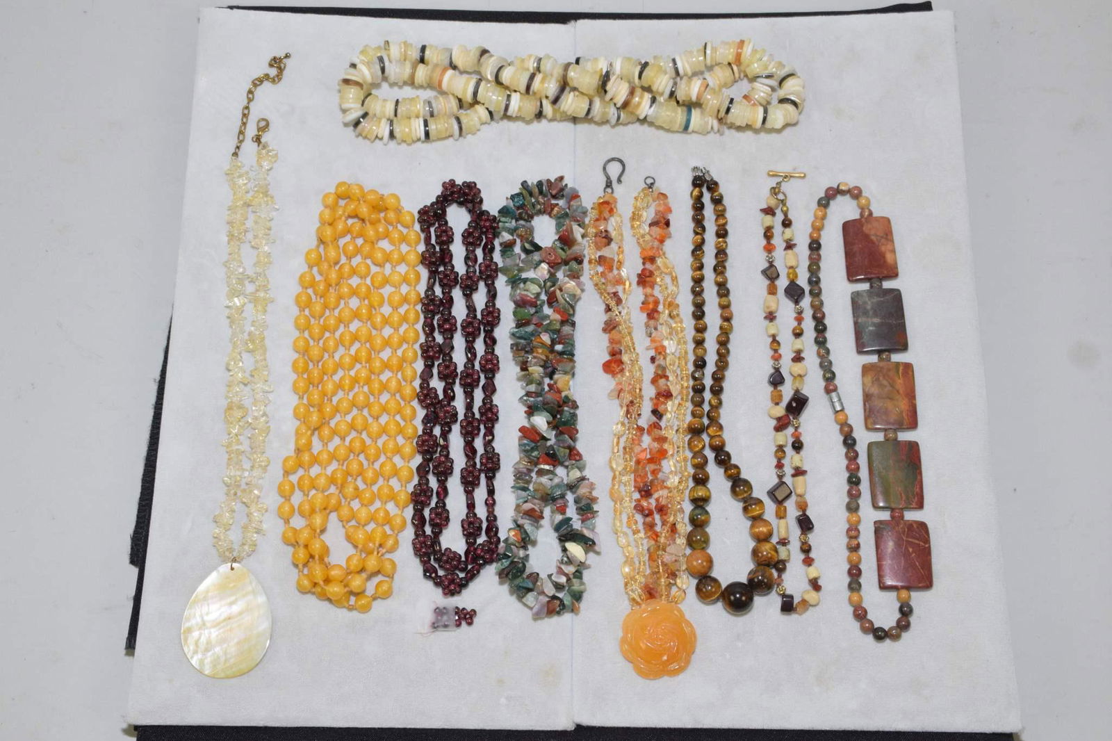 NINE MISCELLANEOUS HARD STONE POLISHED AND BEADED. (1 of 7)