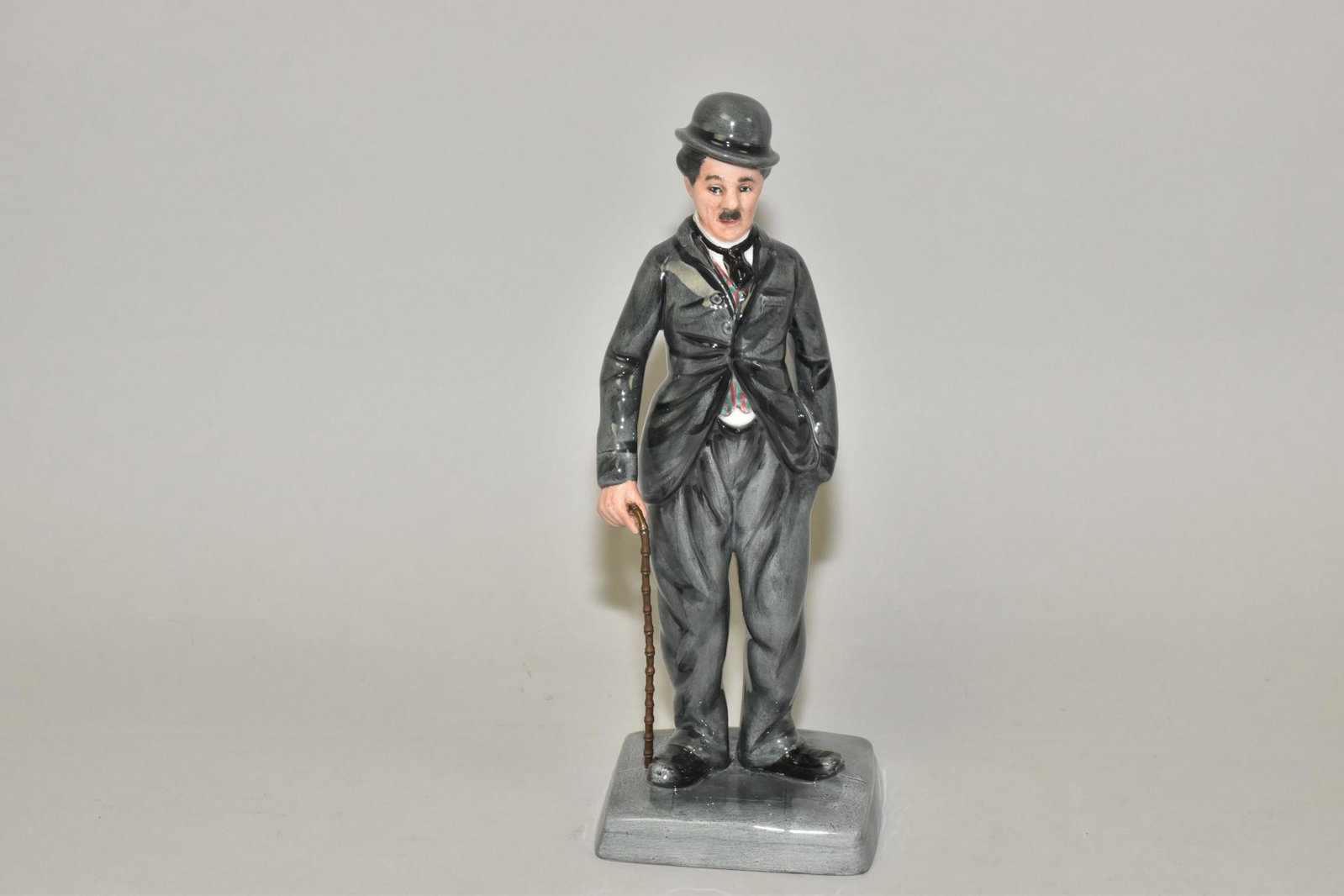 ROYAL DOULTON FIGURINE - Charlie Chaplin,: ROYAL DOULTON FIGURINE - Charlie Chaplin, HN 2771, 594/1889, 9.25" h.