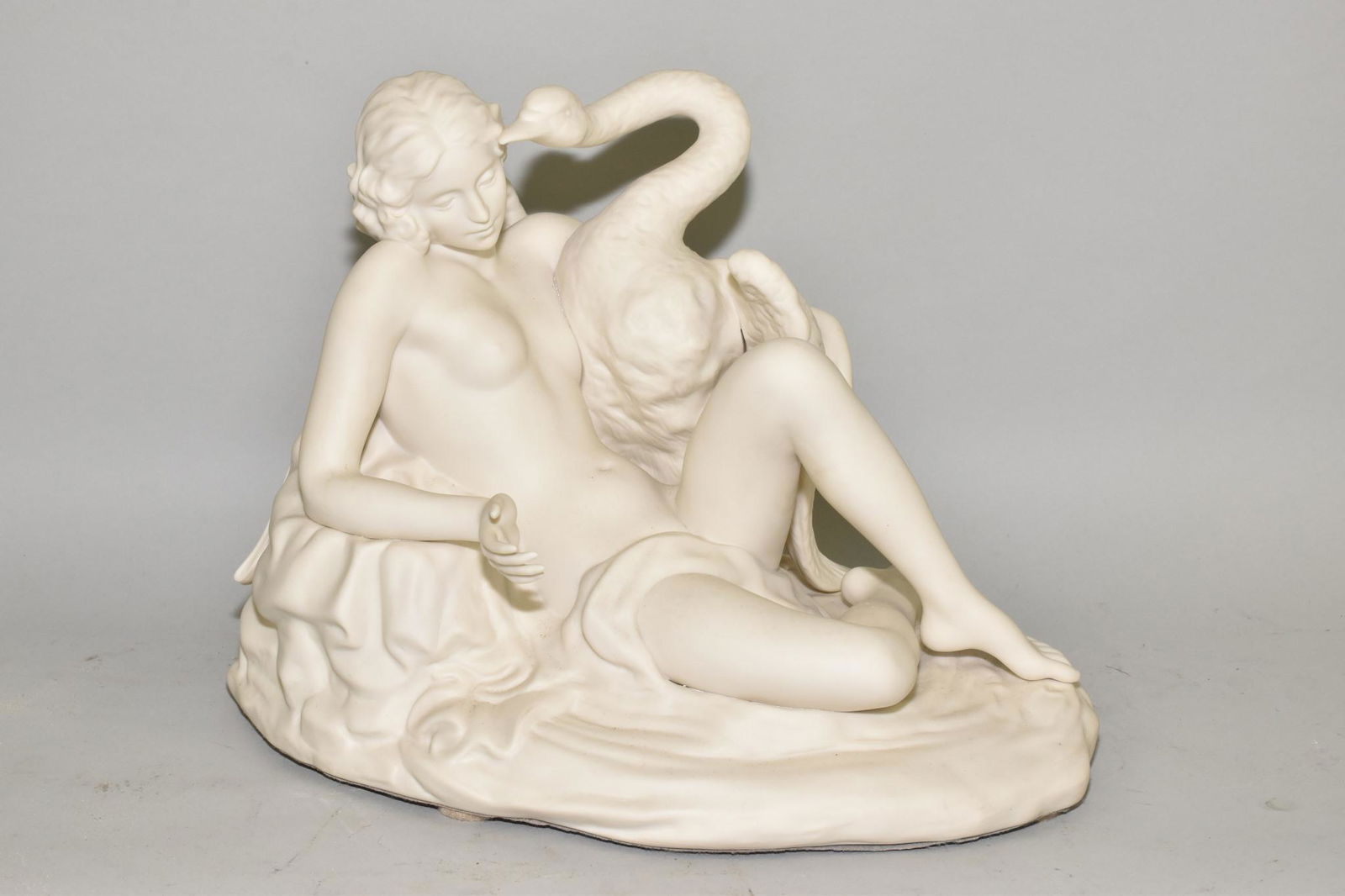 CYBIS PORCELAIN "LEDA AND THE SWAN": CYBIS PORCELAIN "LEDA AND THE SWAN" - Sculpture in white bisque. 10" h. x 9.5" wide x 13" long.