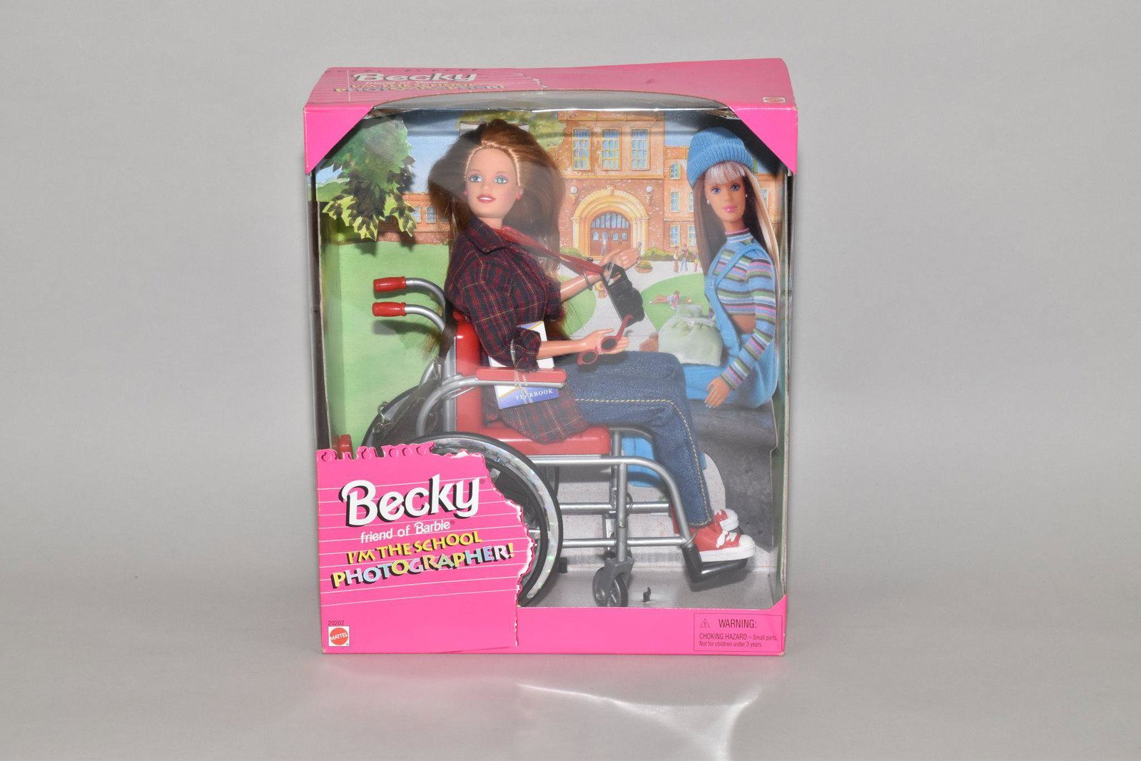 BECKY, FRIEND OF BARBIE - Copyright 1998.: BECKY, FRIEND OF BARBIE - Copyright 1998. Barbie style figure seated in wheelchair. In original unopened packaging. 10" h.