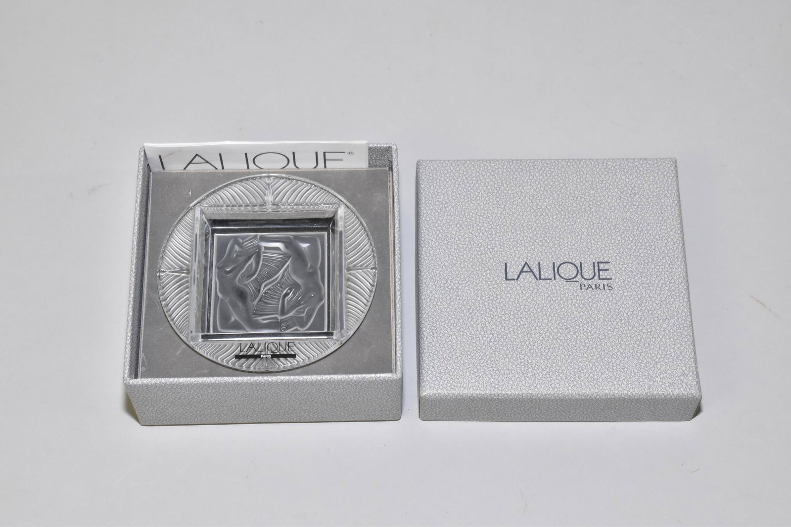 LALIQUE SULFIDE SMALL ASHTRAY -3.75" diameter.: LALIQUE SULFIDE SMALL ASHTRAY -3.75" diameter. New, unused and in the original box.