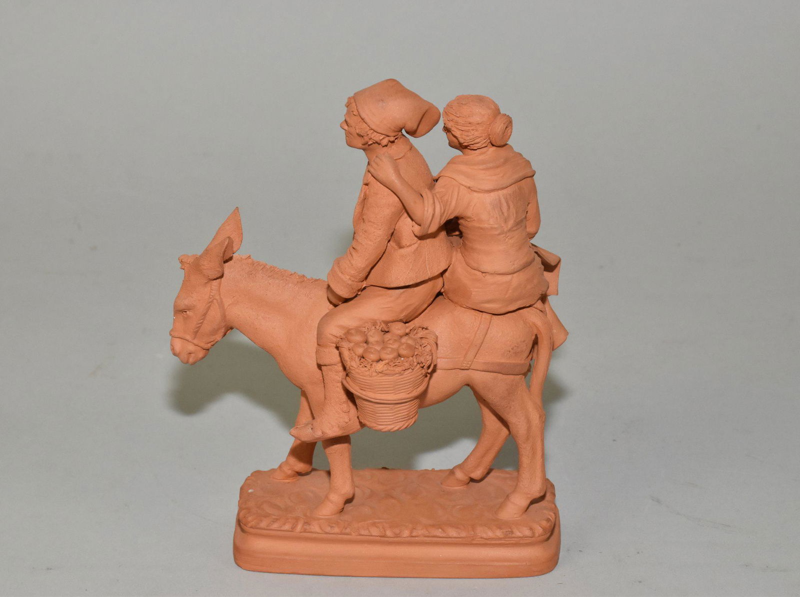 ITALIAN REDWARE STUDIO POTTERY "Going to Market": ITALIAN REDWARE STUDIO POTTERY "Going to Market" -Figure group of husband and wife on a donkey with baskets of produce. 6.5" h.