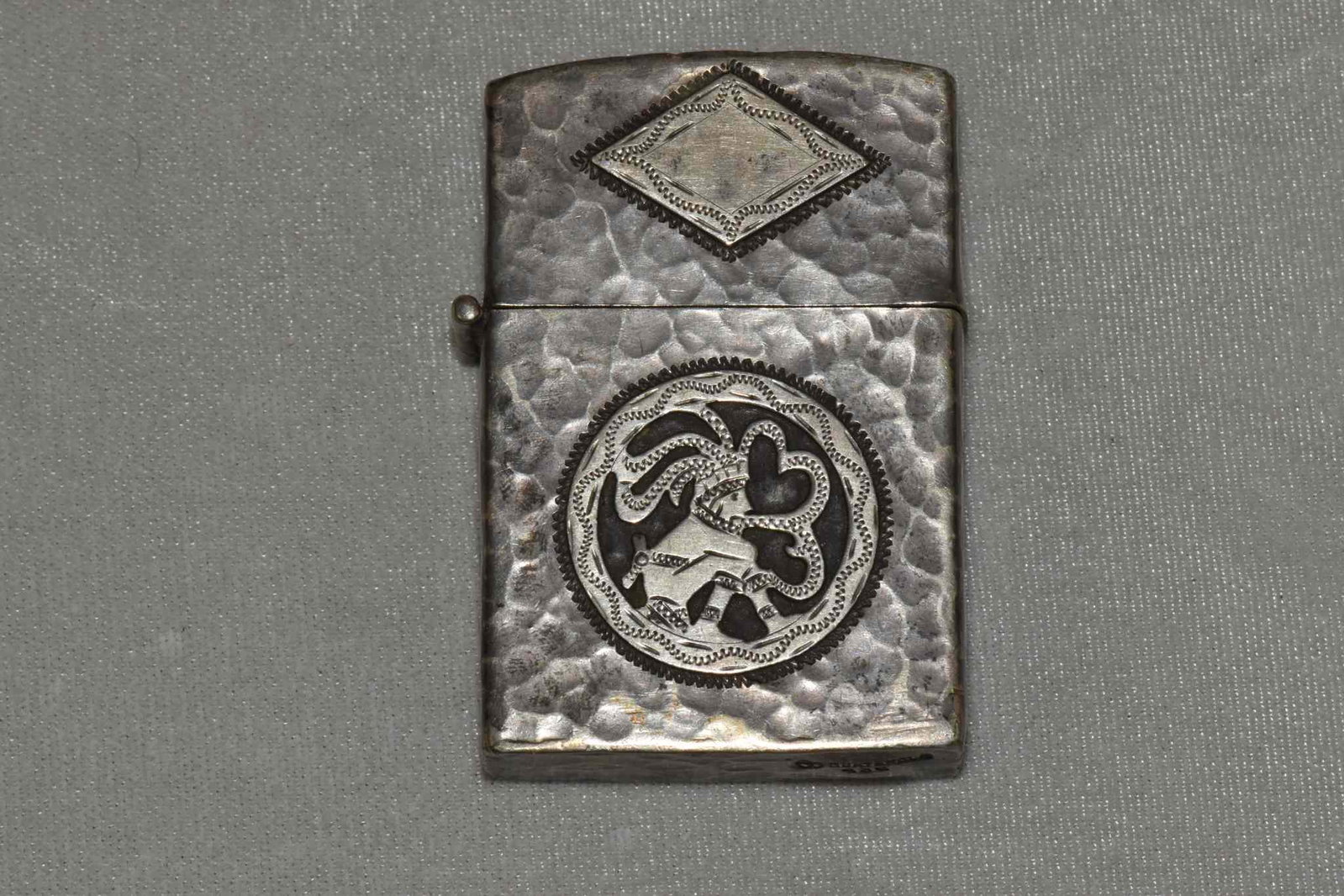 GUATEMALA 925 ANTIQUE STERLING SILVER LIGHTER: GUATEMALA 925 ANTIQUE STERLING SILVER LIGHTER WITH EMBOSSED AZTEC DESIGN. Weight: 1.8 ozt. Dimensions: 2.25 inches high by 1.5 inches wide.