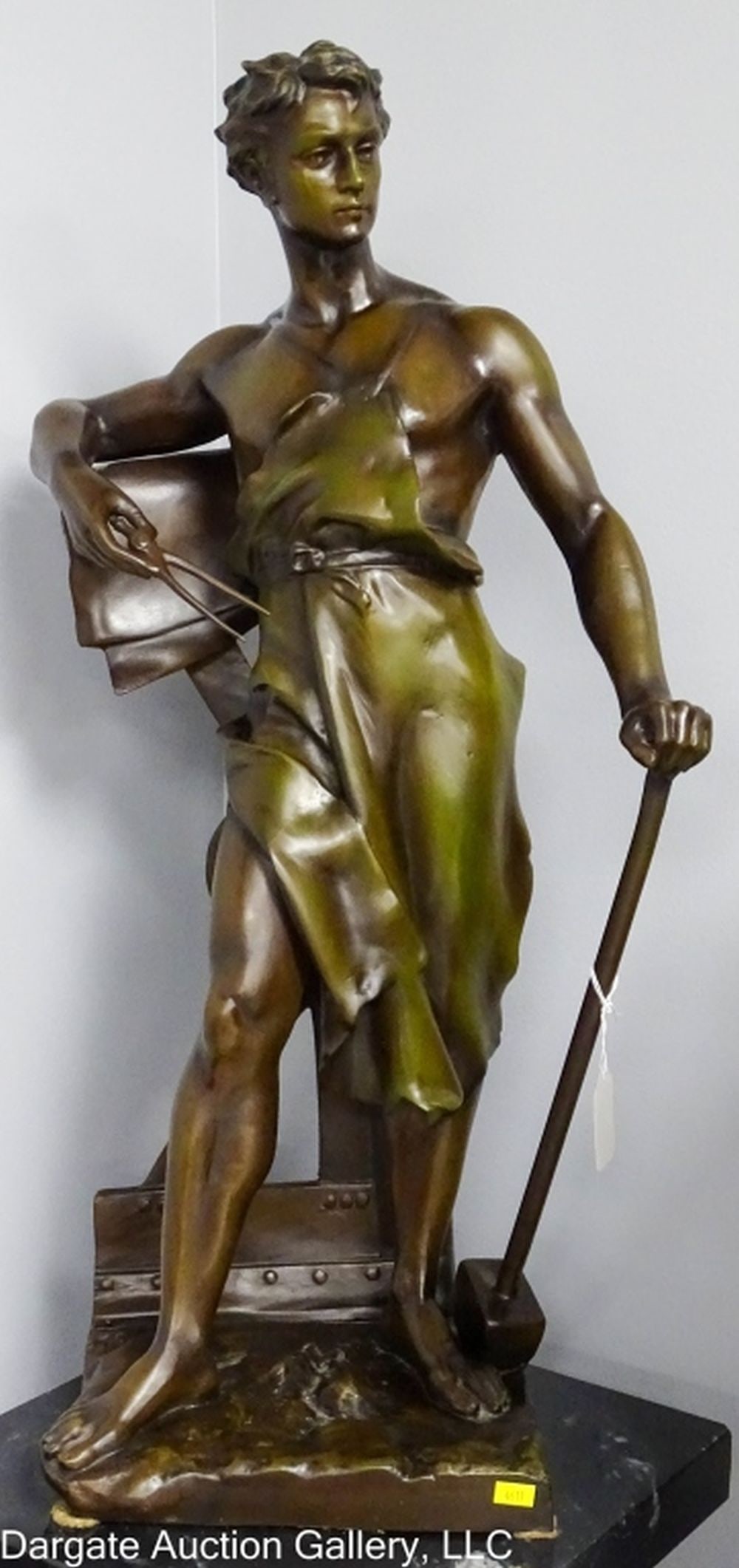 AFTER JEAN-BAPTISTE GERMAIN BRONZE BLACKSMITH: After Jean-Baptiste Germain (French, 1841-1910) Bronze Sculpture Blacksmith depicting a young blacksmith holding a hammer in one hand and tongs in the other. Set on a black marble base / Measures: 30"
