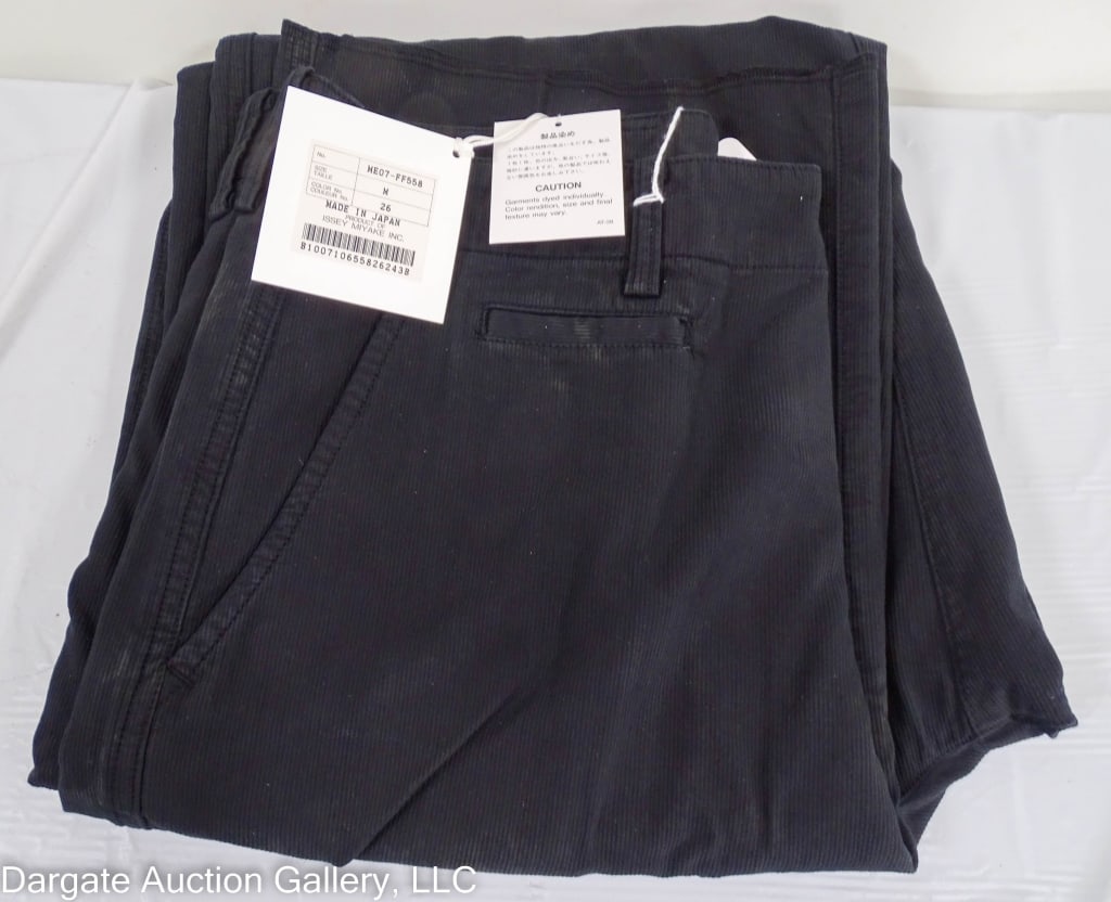 ISSEY MIYAKE COTTON CORDUROY PANTS: Flat front straight and angled pockets on front, 2 straight buttoned pockets on the back / corduroy style/ Button fly new with tags / Measurements: Size M (26) / Condition: New with tagsDISCLAIMER: **