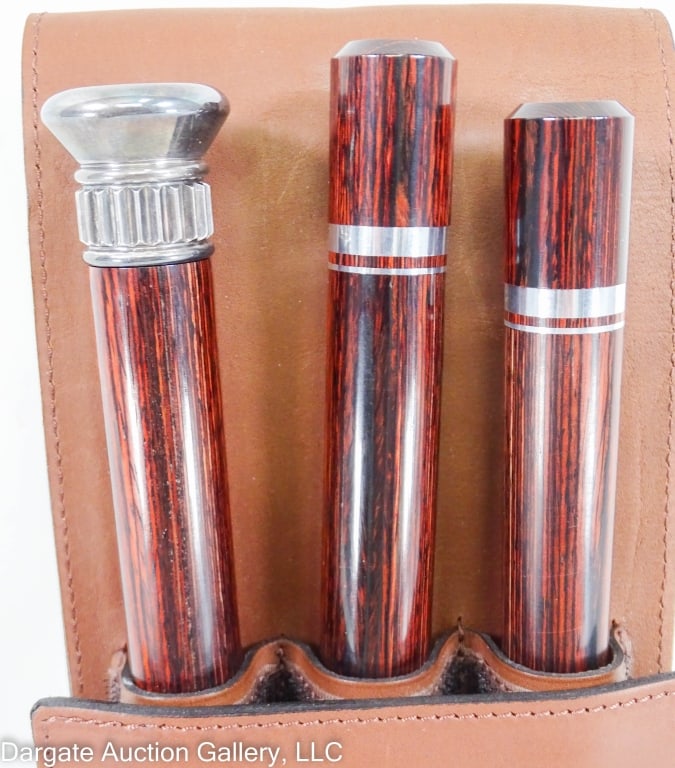 BRANDY SMUGGLER WALKING CANE: Cane comes in 4 sections with hidden compartments that screw together. There are 2 long sections with 9.5" flasks and 2 short sections with 2.25" "glasses" - includes a leather storage case (14"H x 5"