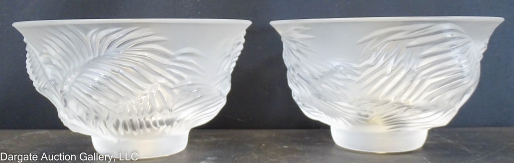 PAIR LALIQUE KELAPA BOWLS: Frosted palm leaf design / Original stickers and marks on base / Mark - Lalique France, Stickers - Lalique Paris / Measures: 3.75"H x 6.75"W / Provenance: From the descendants of Lollie Oliver, Pittsu