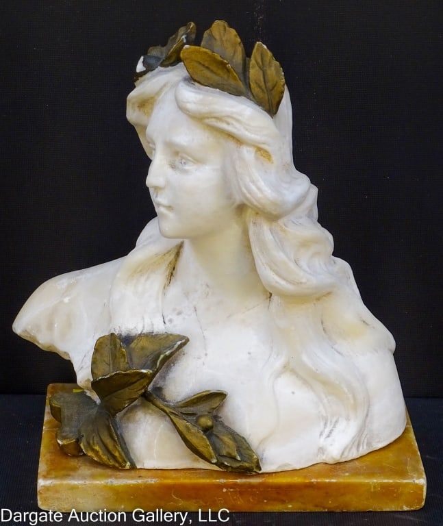 CARVED ALABASTER BUST OF A WOMAN WITH LAURELS: Carved Alabaster Bust of a woman with Laurels in her hair - Signature on base "Sappho" / Measures: 8"H x 8"W x 4"D / Condition: There are a few areas of damage - paint loss to leaves, one leaf on head