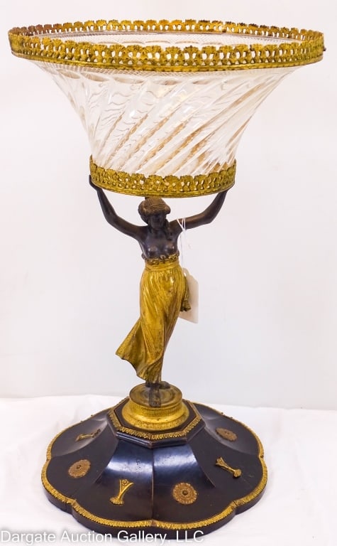GILT & EBONIZED BRONZE BACCARAT CENTERPIECE BOWL: Figural gilt and ebonized bronze centerpiece, semi-nude form in the French empire style / cut glass bowl attributed to Baccarat / Measures: 18"H x 11" diam / Provenance: From the descendants of Lollie