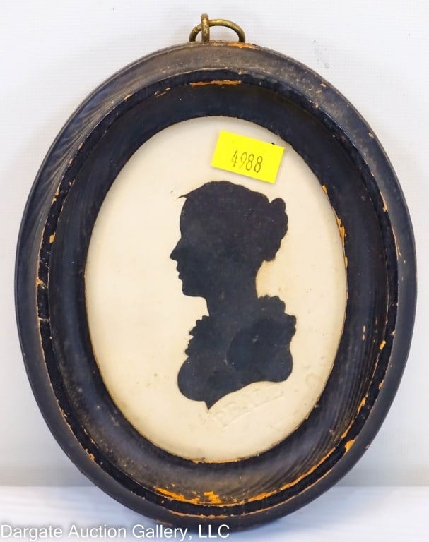 PEALES MUSEUM SILHOUTTE ATTRB TO RAPHAELLE PEALE: Attributed to Raphaelle Peale (American/PA/MD, 1774-1825) / Silhoutte of a woman, left facing, embossed Peale Museum stamp below / Set under glass in black oval frame / Visible Art Size: 4"H x 3"W / F