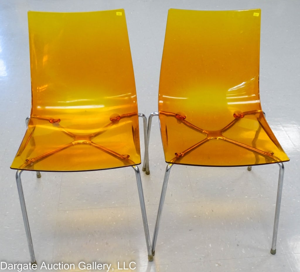 PAIR SLIM CHAIRS BY ROBERT FOSCHIA: Soft line amber shaped seats on chrome legs / Made in Italy / Designer R Foschia / Measures: 31"H x 16"W x 16"D / Condition: Minor surface scratches and wear