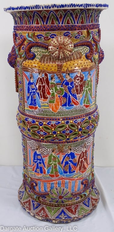 SATSUMA PORCELAIN UMBRELLA STAND: Figural panels with raised decoration, reticulated center in leaves / Measures: 24"H x 10.75" diameter / Condition: Repairs on base and rim