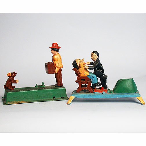 2 MECHANICAL TOY BANKS. N/R. (1) Monkey b: 2 MECHANICAL TOY BANKS. N/R. (1) Monkey bank, cast iron painted mechanical toy bank. No mark. Size: 7''H, 7 1/2''W, 2 3/4''D. Condition: Reproduction, some rust along bottom front left corner. Sold as