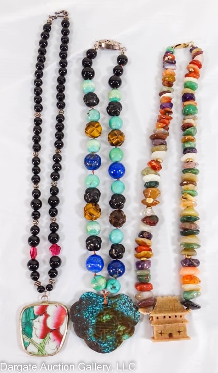 3 CHINESE HARDSTONE NECKLACES WITH PENDANTS: Includes: Chipped hardstone necklace with a carved pavilion and 10k yellow gold beads and clasp (21?L) beads are rough cut, natural shaped, but polished / Onyx beads with floral pendant, silver tone h
