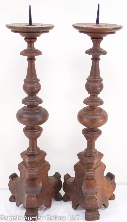 PAIR ANTIQUE PRICKETS SPANISH BAROQUE CANDLE HOLDERS: Pair antique Prickets candle holders, on tripod base, with turned columns and worm holes. / Measures: 23" x 6" / Provenance: From the descendants of Lollie Oliver, Pittsburgh, PA / Condition: worm hol