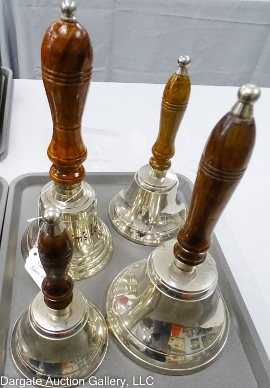 SET FOUR GRADUATED SCHOOL BELLS: A set of graduated chrome plated school bells. One inscribed "Captain's Table". Made in India, Upper deck limited. Biggest is 11.5" x 6", Smallest is 8" x 4". / Provenance: From the descendants of Lol