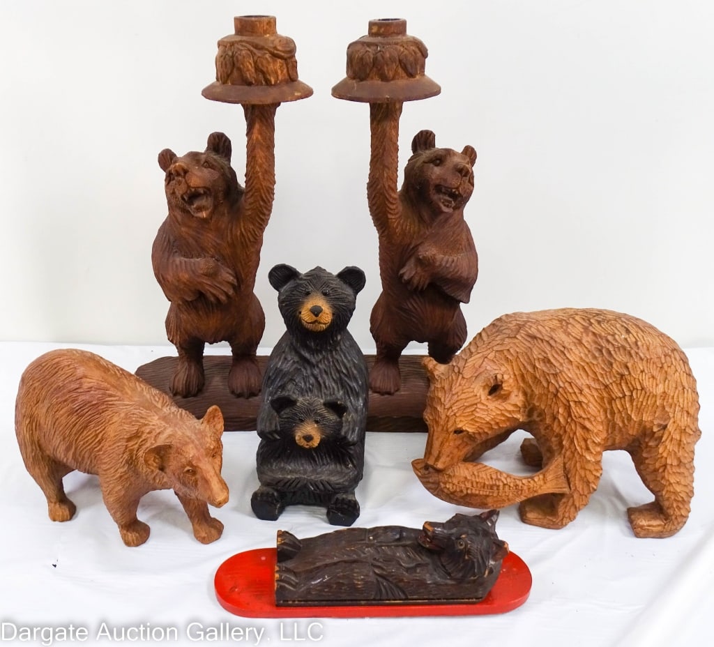 6 PCS BLACK FOREST STYLE CARVED BEARS: Six pieces of black forest style carved bears, including a pair of black forest honey pot bear candlesticks, two standing bears, a seated bear cub, and a wall carving. Candlesticks measure 15" x 17.5"
