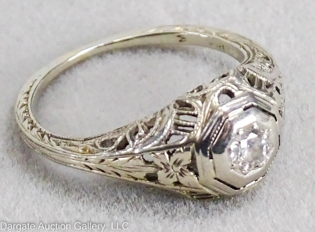 18K WHITE GOLD DIAMOND RING: Reticulated white gold design, set with a single round diamond (approx. .25 carat) / Marked 18k / Weight: 2.4g / Measurements: Size 3.5/ ONLINE PAY MSG ****SEE TERMS AND CONDITIONS FOR SPECIAL PAYMENT