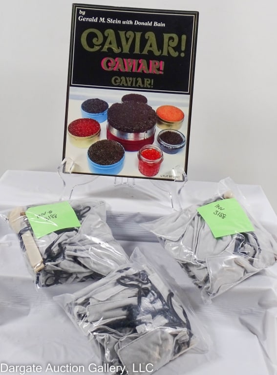 97pc ASST CAVIAR SERVICE ITEMS: Includes: (1) Book - Caviar! Caviar! Caviar! By Gerald M Stein with Donald Bain / (90) 2.25" Horn Caviar Spoons by Arca / (3) 2pc sets Horn Caviar serving spoon & spreader by Arca