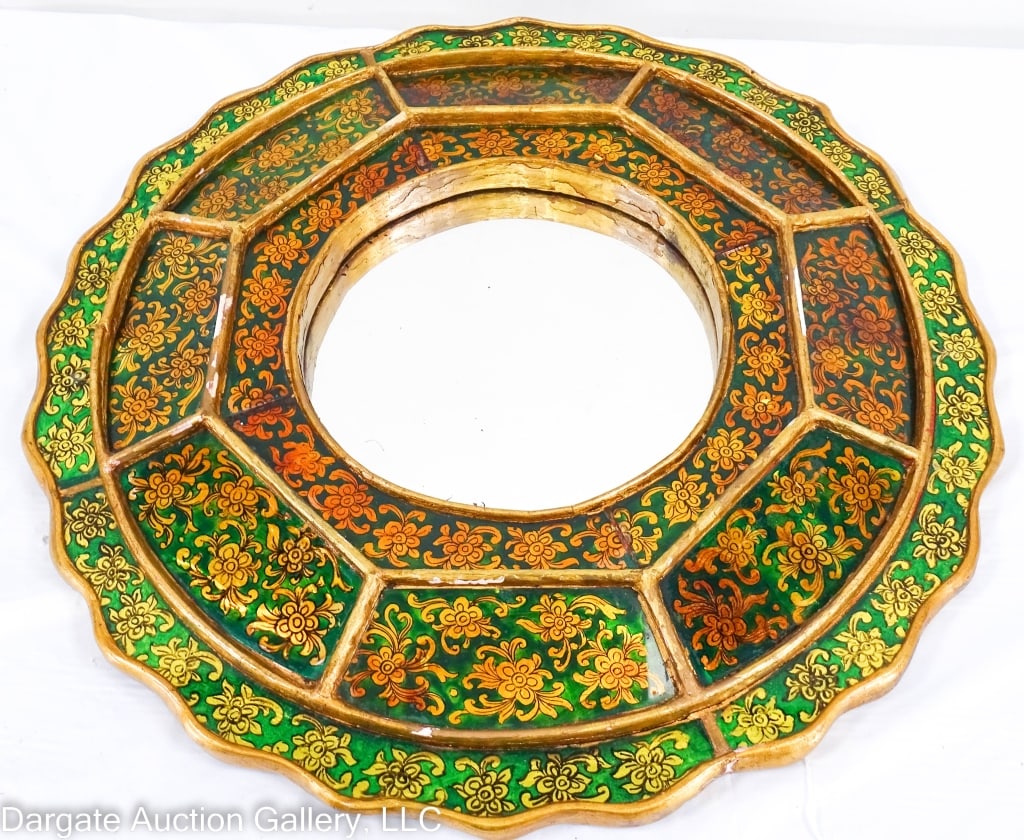 PERUVIAN REVERSE PAINTED WALL MIRROR: Round wall mirror with reverse painted glass. Green ground with yellow floral pattern, scalloped edge with round central mirror / Measures: Overall: 16.5" diam / Mirror: 7 " diam / Condition: gilt wor