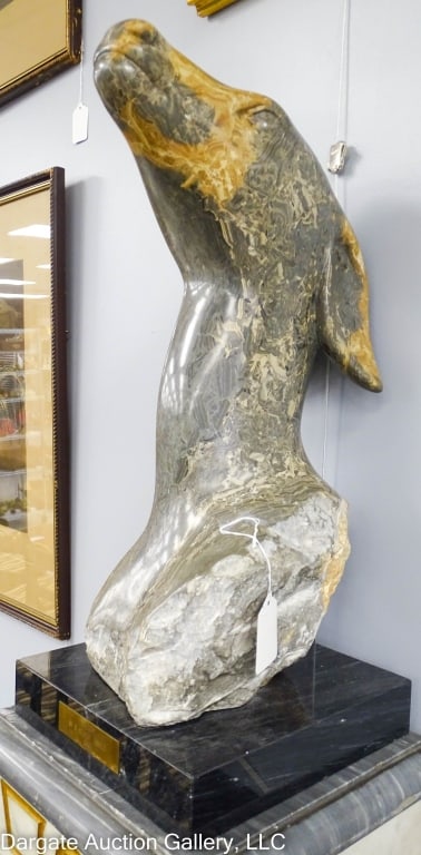 W. STANLEY PROCTOR SOAPSTONE SCULPTURE MAIDEN: W Stanley (Sandy) Proctor (American, b. 1939) 1989 Soapstone sculpture titled "Maiden" depicting the head of a deer. Affixed to a marble base / Measures: 23"H x 8.5"W x 9"D / Provenance: From the desc