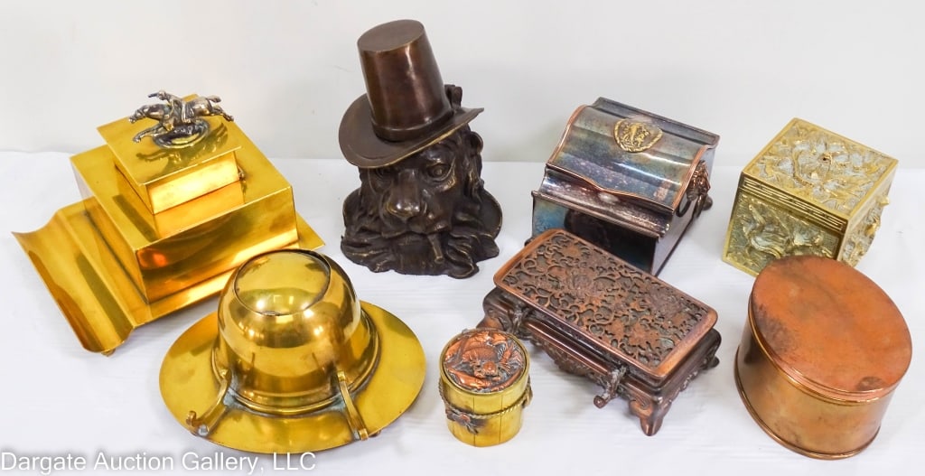 8 BRASS & COPPER INKWELLS, HORSE RACE, LION: Antique and vintage inkwells: Large brass with horse race rider; brass Bradley & Hubbard; cast brass lion smoking cigar in top hat; oriental chrysanthemum lid; small round brass with copper fish lids.