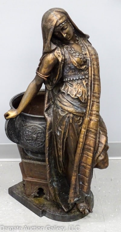 ANTIQUE SPELTER VICTORIAN GARDEN STATUE & URN: Large antique Victorian garden spelter figure of an Arabic woman standing beside urn on stand / Measures: 32"H x 16.25"W x 19"D / Condition: Shows wear and pitting, missing left hand, figure somewhat 
