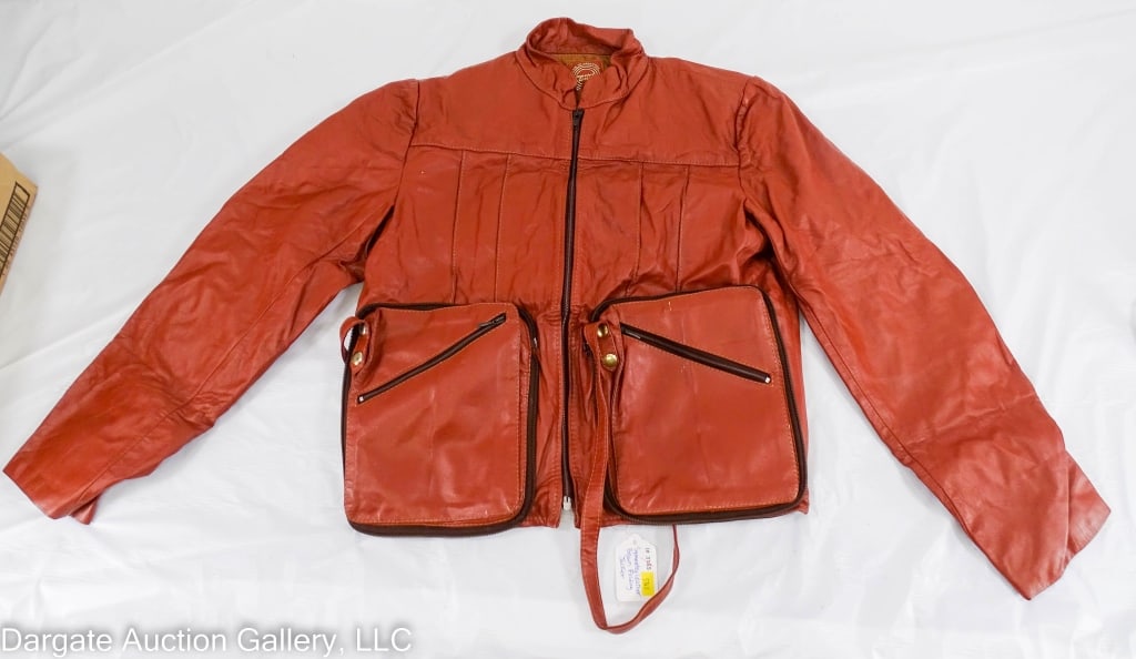 SYMMETRY LEATHER BROWN FOLDING JACKET PURSE: Symmetry Leather Made in Argentina" Jacket folds into a purse / Closed: 8"H x 6"W / Jacket: Shoulder to shoulder 16", Shoulder to cuff 24", chest 16", armpit to cuff 16