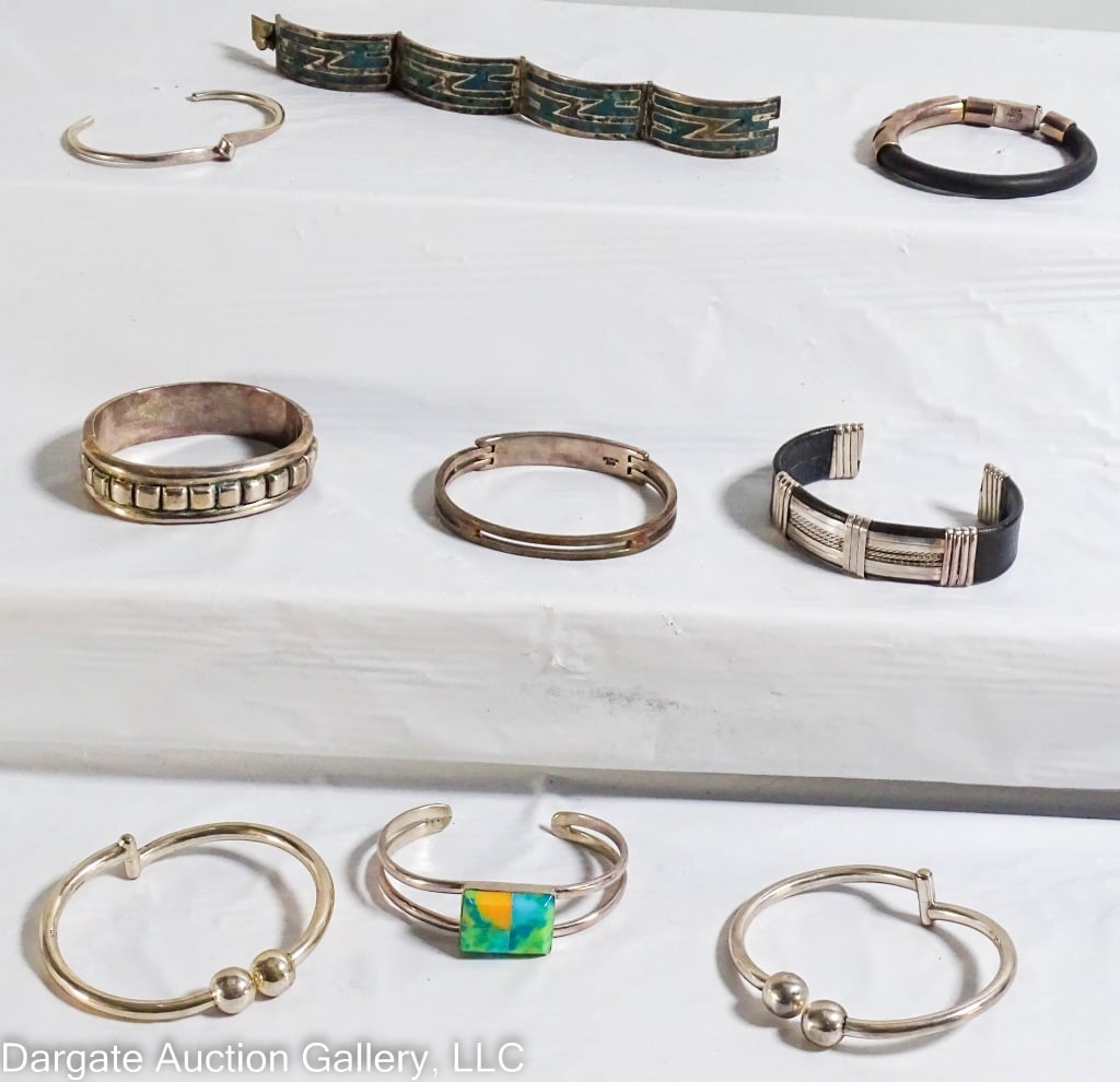 9 MEXICO STERLING SILVER BRACELETS: Includes: Sterling hinged bracelet, with raised square design, marked ATI 925 MEXICO (Athra Trading Inc), 2.5?W, 55g / Sterling cuff bracelet, with inlaid faux stone, marked 925 MEXICO P&K ;2.5?w, 34.